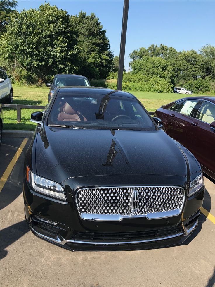 Black Lincoln luxury sedan front view