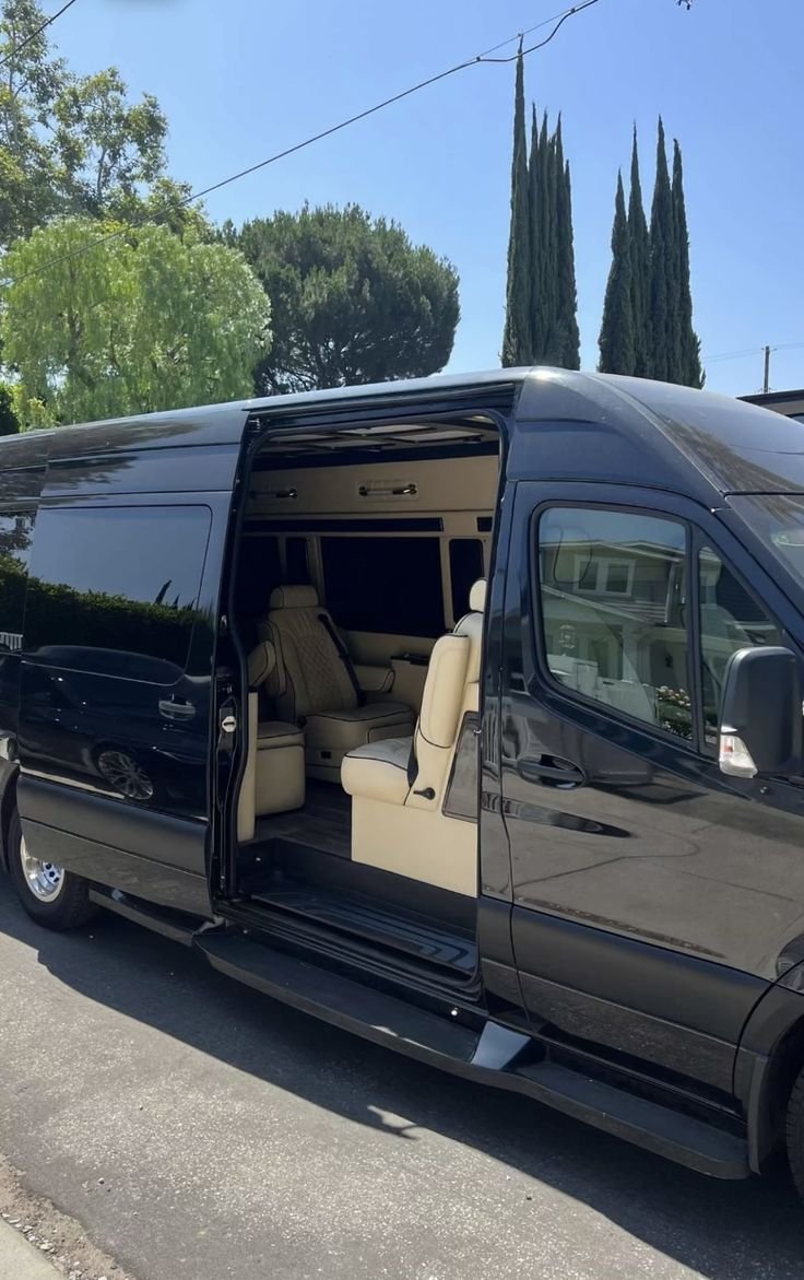Black Jet Sprinter limo van with luxury captain seating